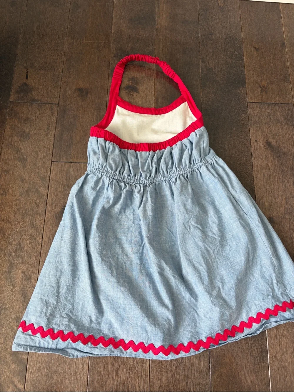 Gymboree Toddler Girl Denim Halter Dress with red trim and cherry pockets .